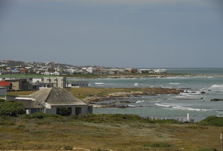 Familienreise Südafrika mit Kindern - Garden Route for family individuell deluxe - Cape Agulhas Häuser am Meer